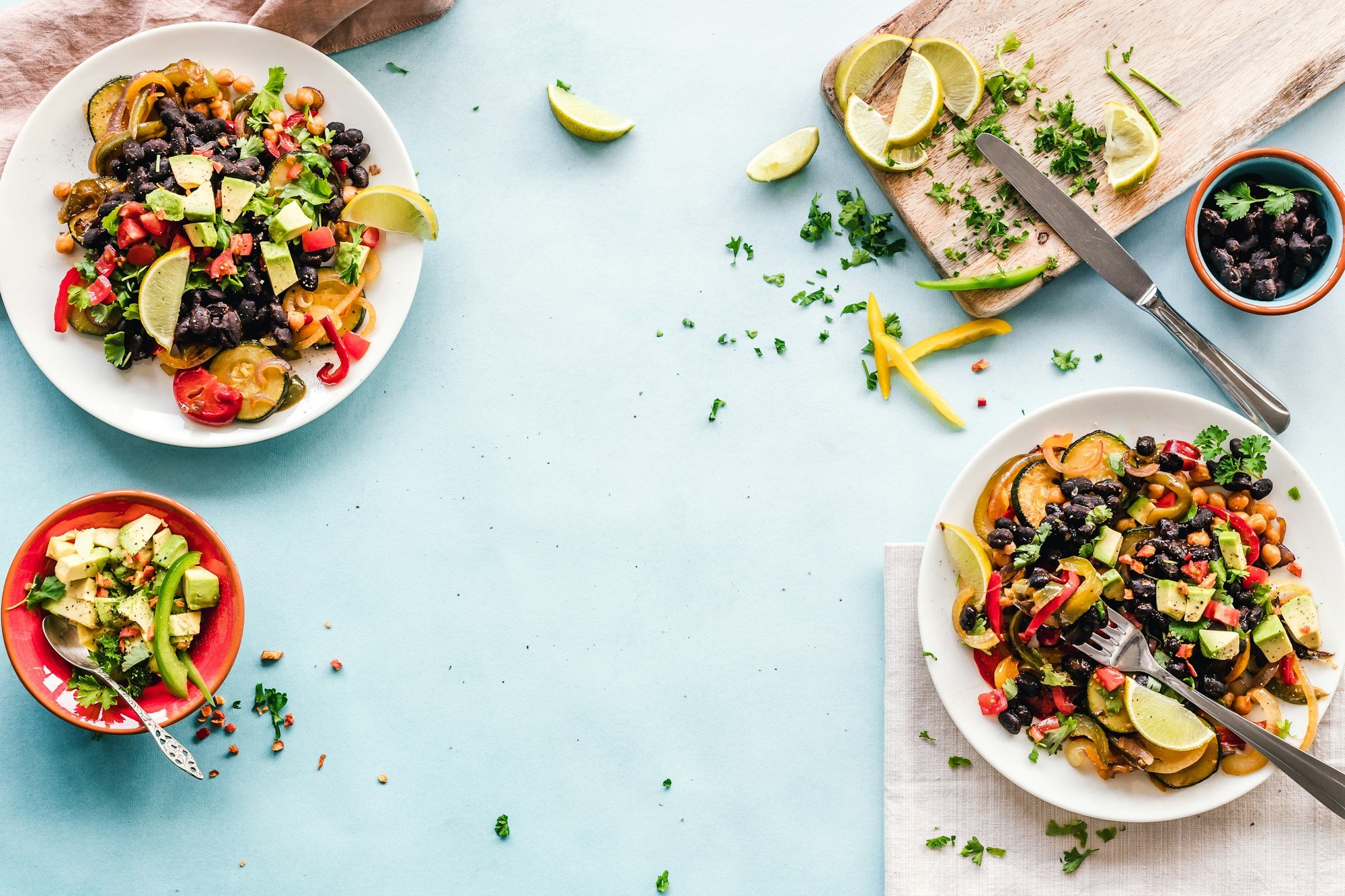 Balanced bowls of vegetables and grains on a table