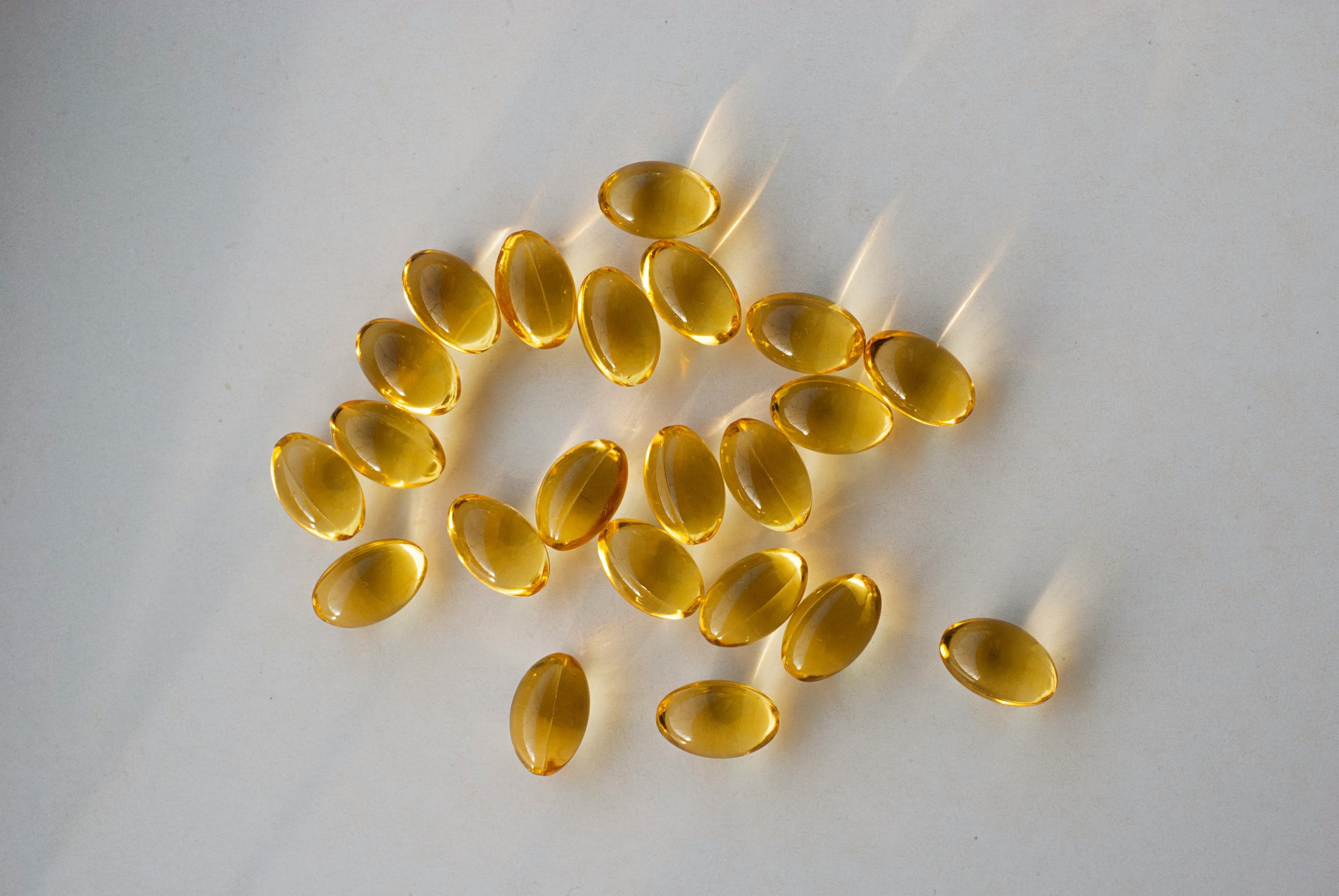 Fish oil capsules on a neutral background