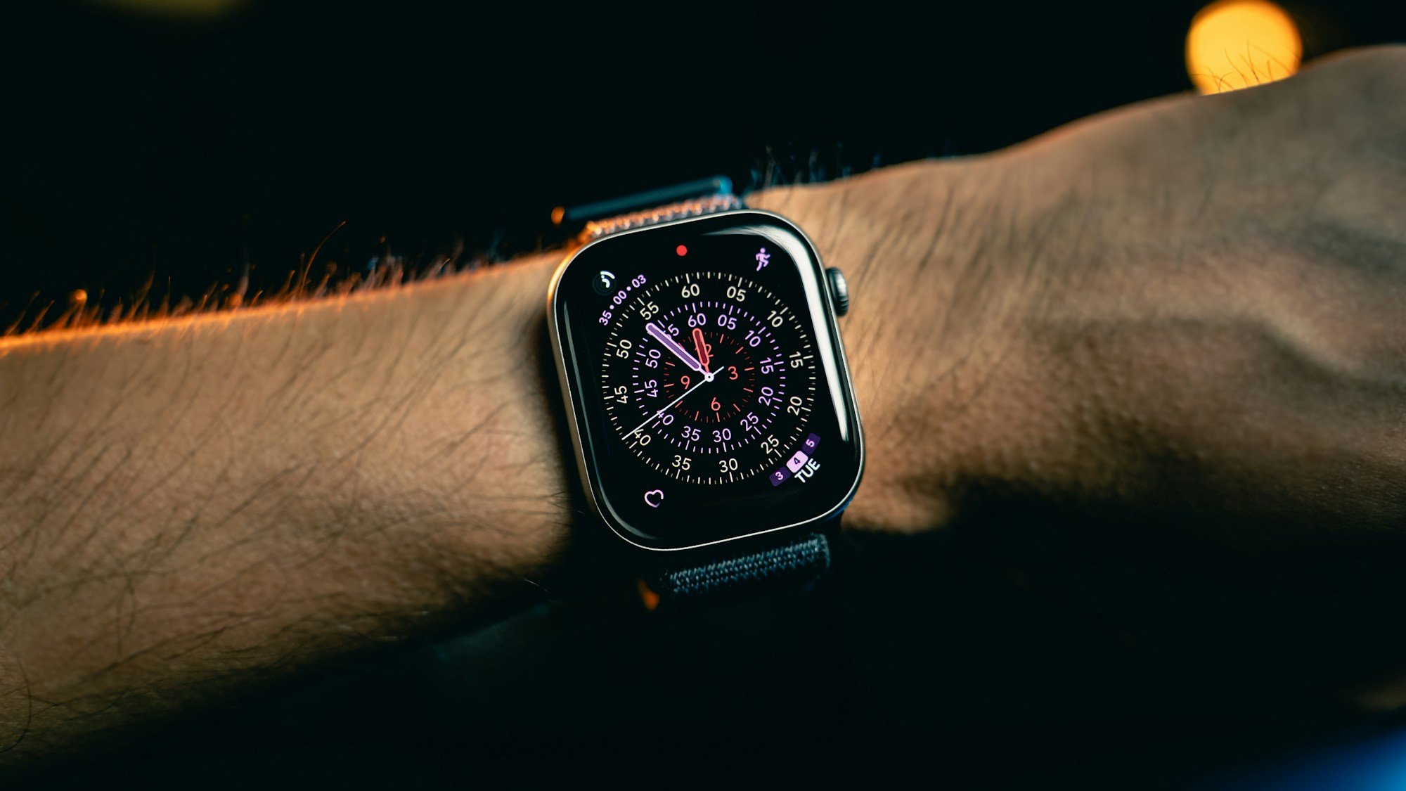 A smartwatch worn at night, representing sleep tracking data