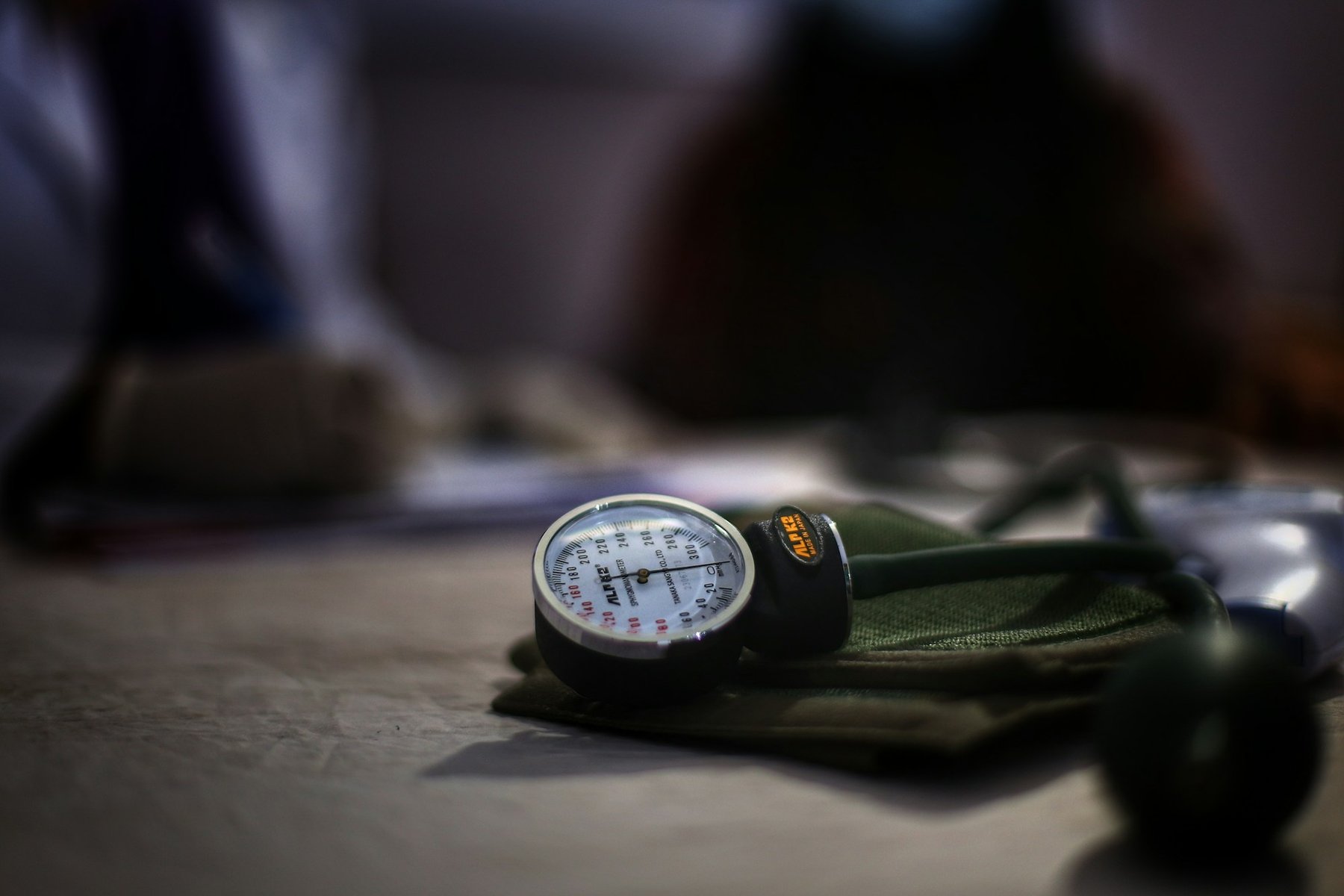 A blood pressure monitor resting on a table at home