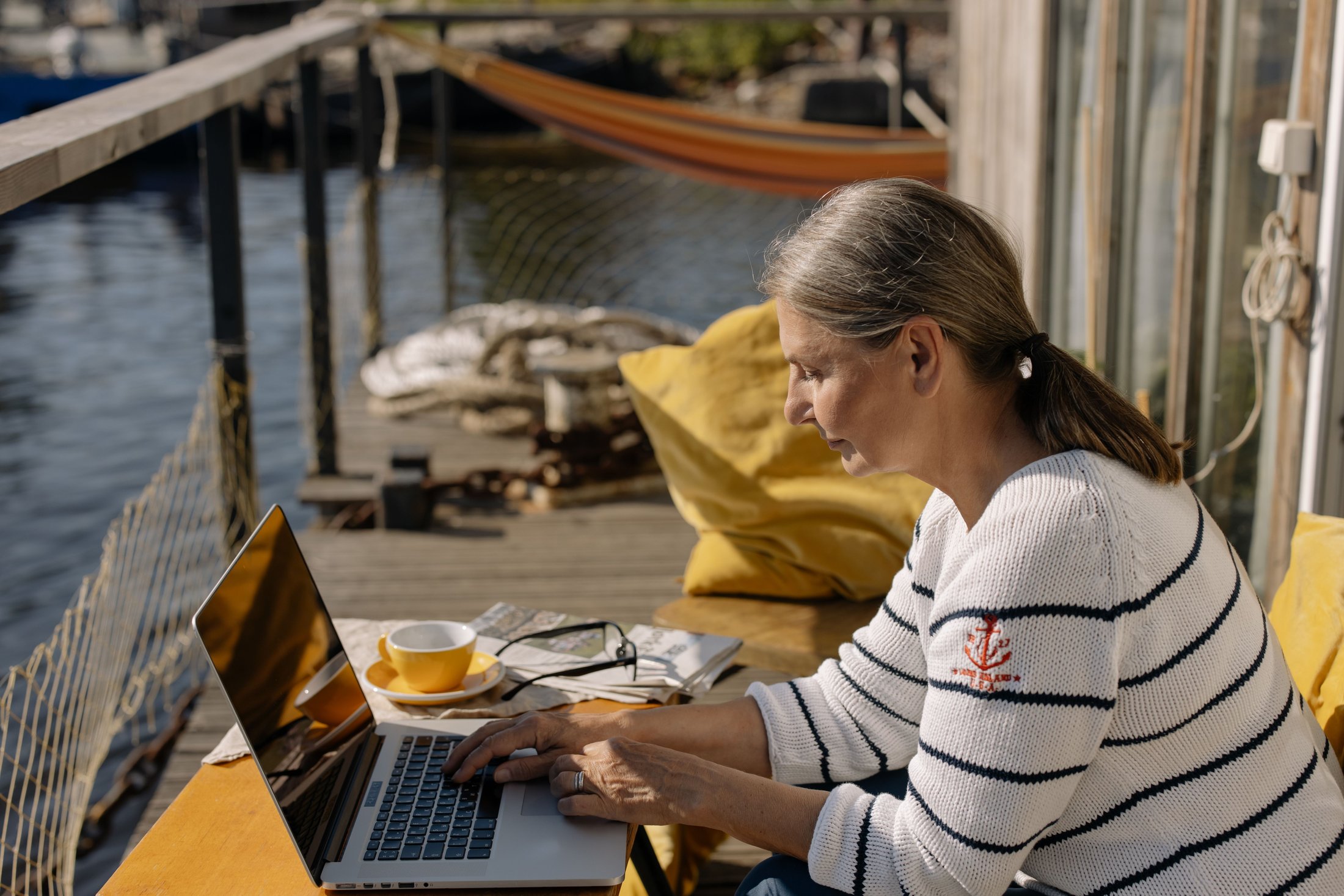Woman typing on a laptop during focused work