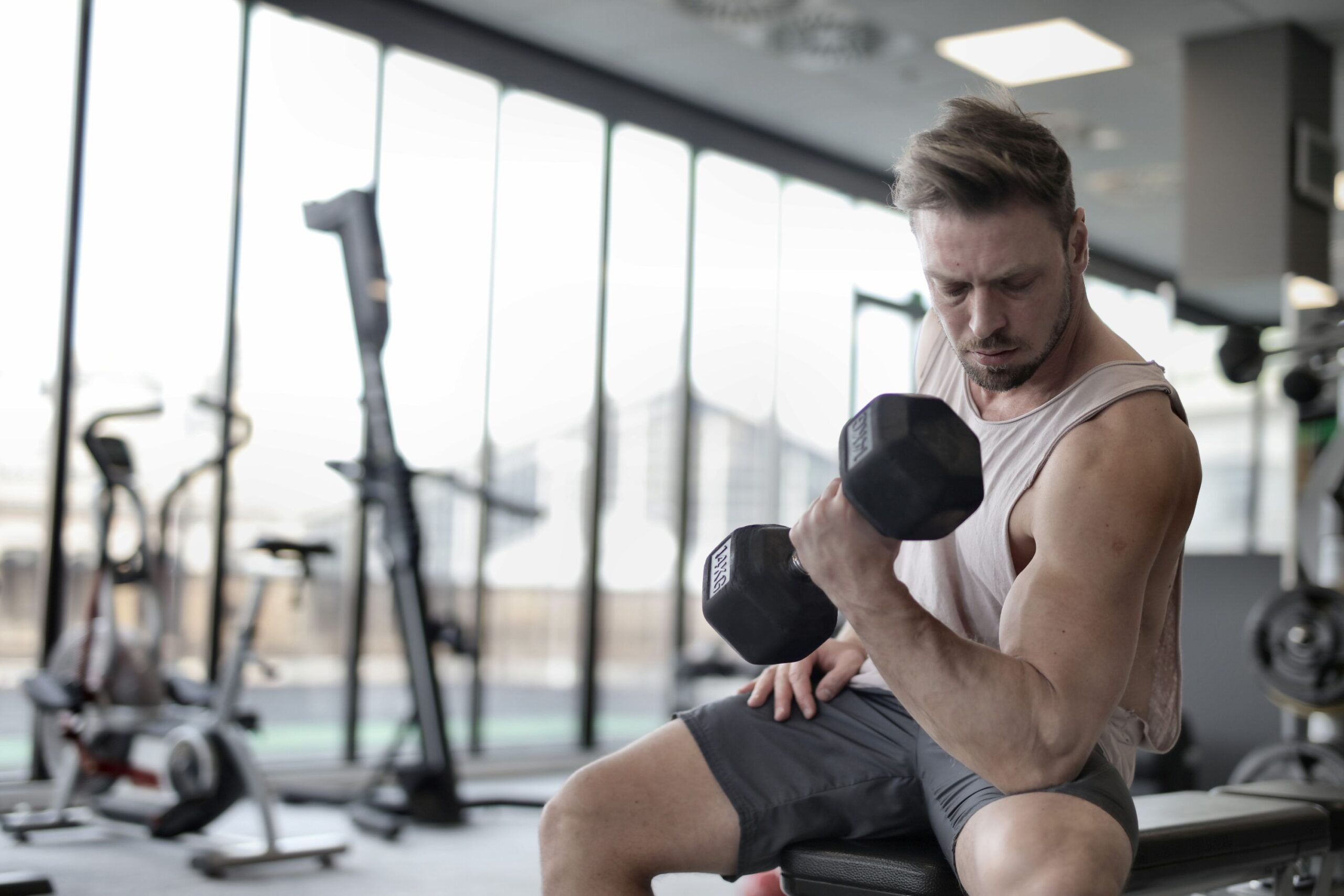 Senior man lifting dumbbell for strength training exercise