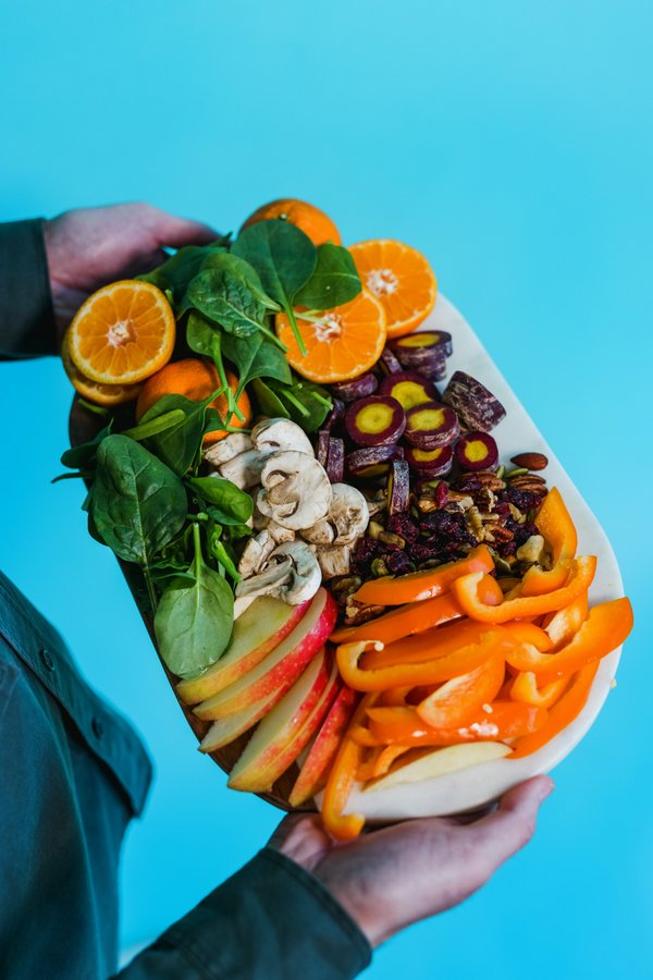 A plate of sliced carrots and green leaves