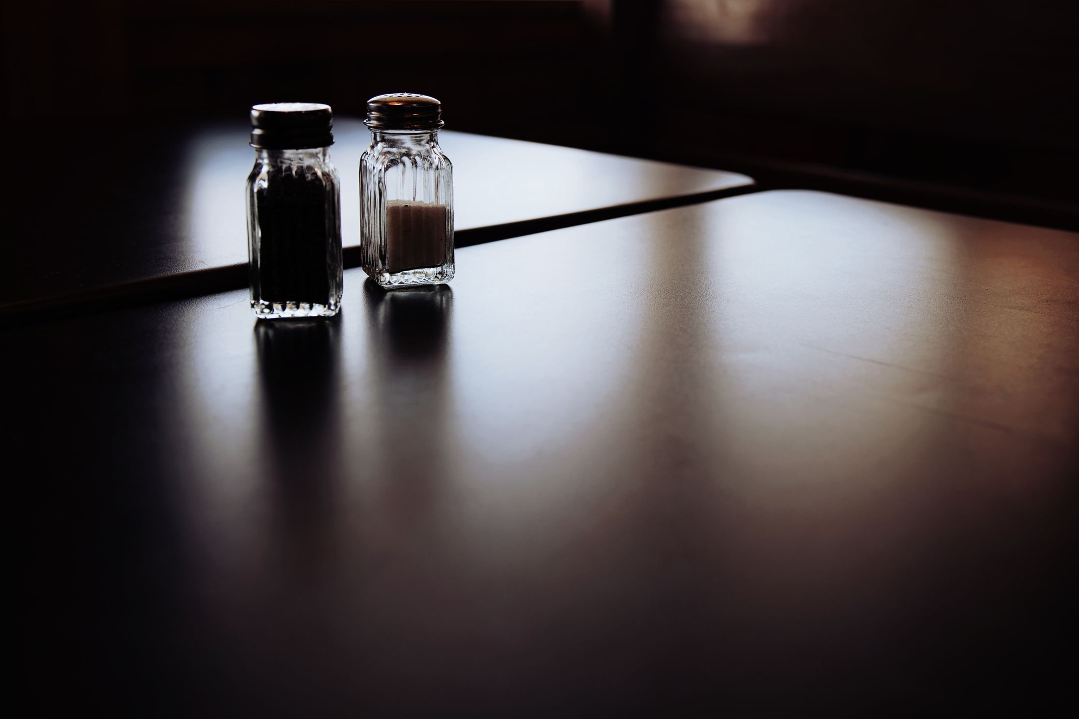 Salt and pepper shakers on a table