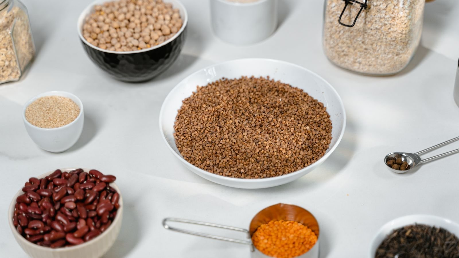 Bowls of grains and beans on a table