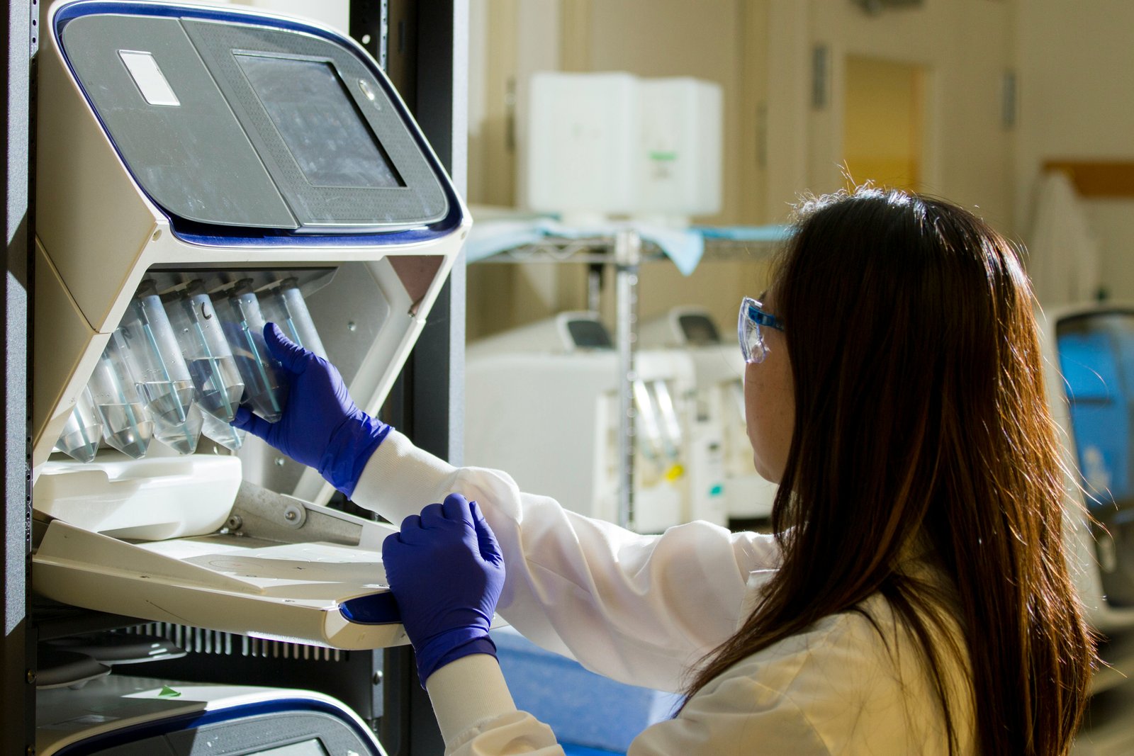Laboratory technician preparing genetic sequencing samples