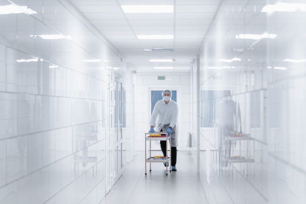 A clinician handling laboratory samples, used to illustrate hormone testing in menopause.