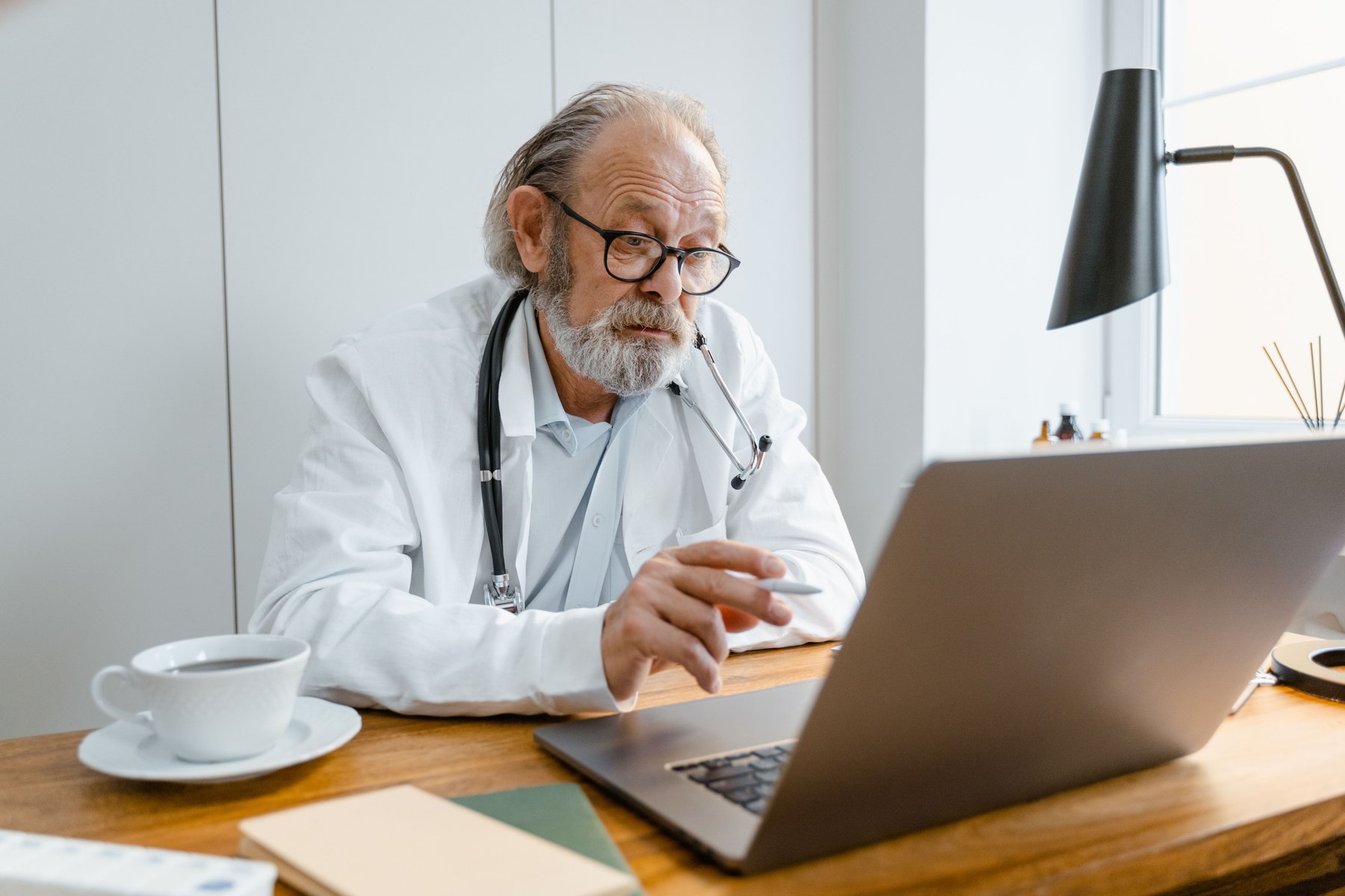 Doctor speaking with patient through medical teleconsultation