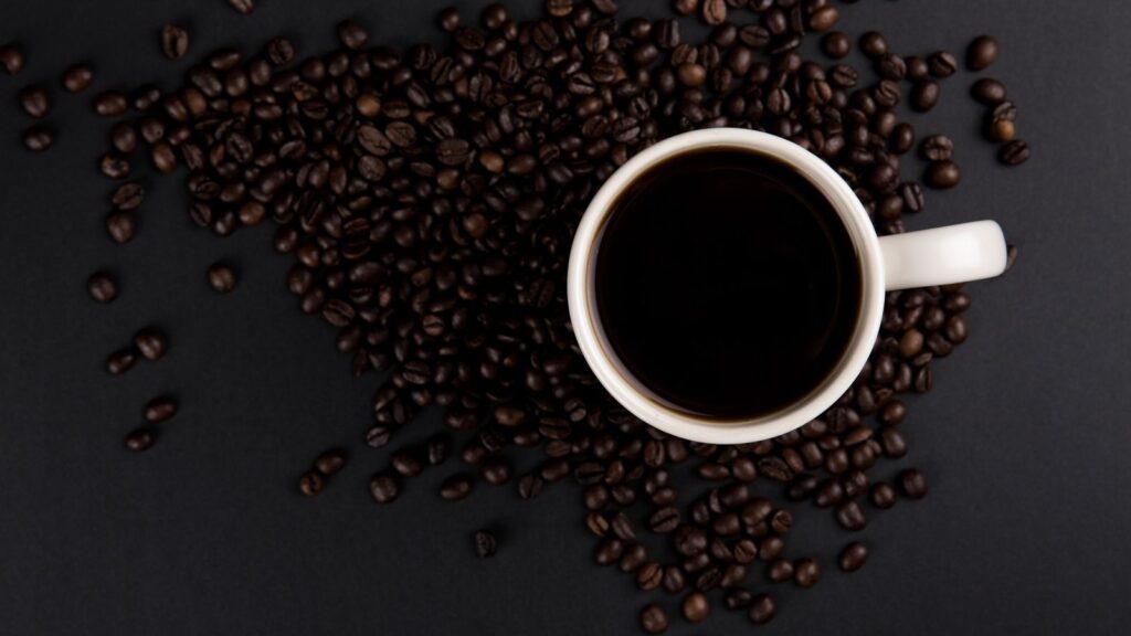 Coffee cup on table by a window