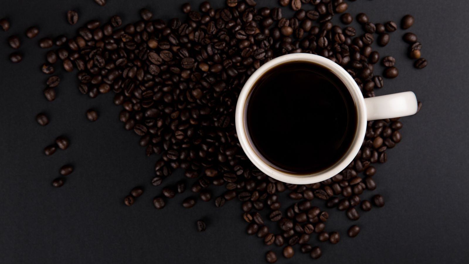 Coffee cup on table by a window