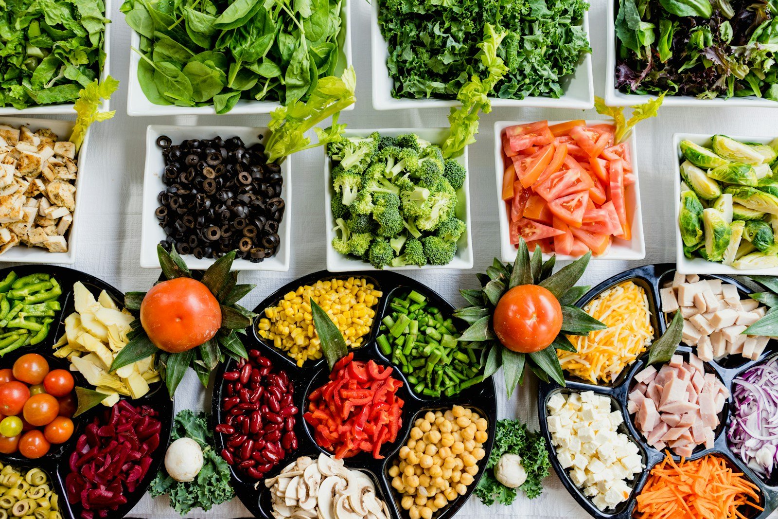 Colourful vegetables and salad ingredients on a wooden surface