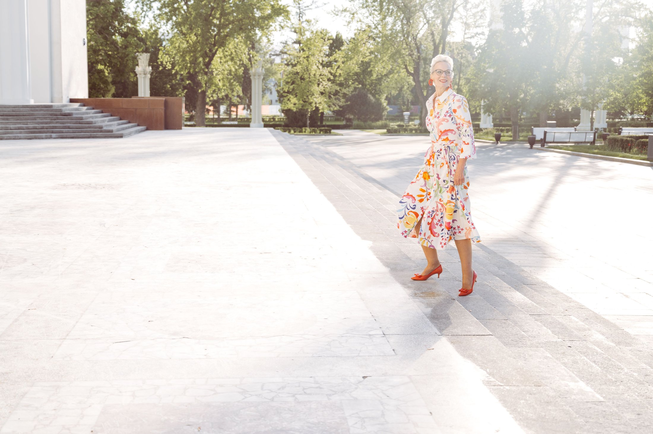 Senior woman walking up outdoor stairs