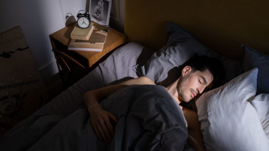 A quiet bedroom in morning light, used to illustrate sleep timing and social jet lag