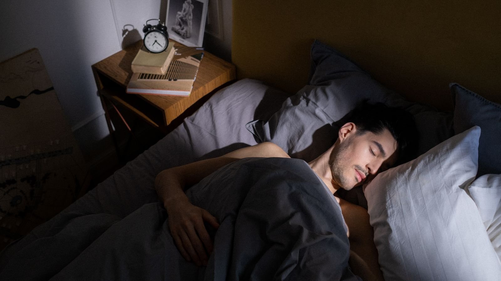 A quiet bedroom in morning light, used to illustrate sleep timing and social jet lag