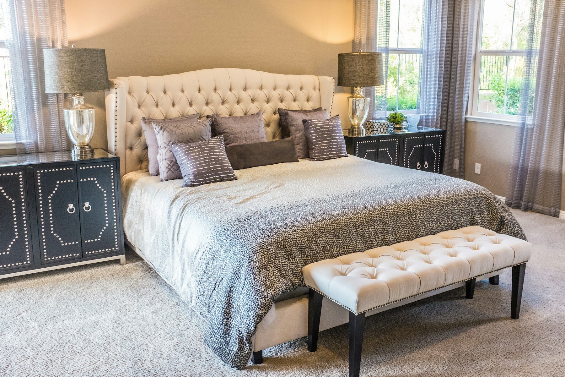 Bedroom with open window and books by bed