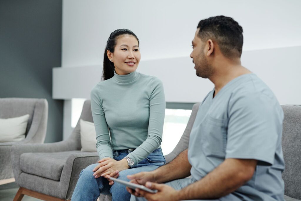 A doctor talking with a patient during a consultation
